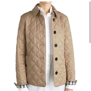 Authentic tan Burberry jacket — a classic.